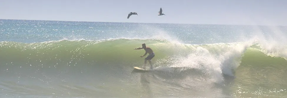 man surfing a wave in Satellite Beach